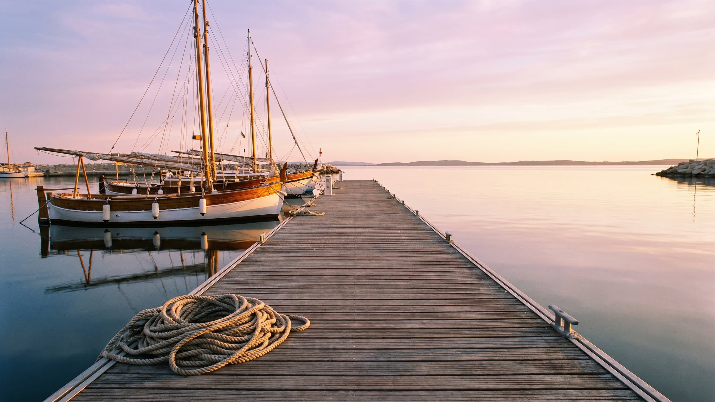A pontoon at first light, calm sea